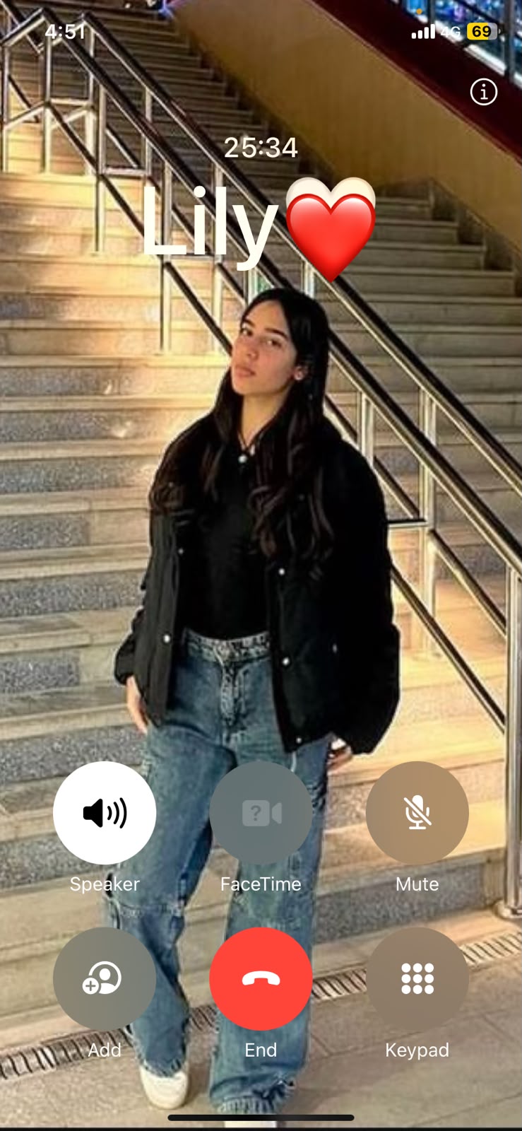 Phone call screen with photo of Lily on stairs
